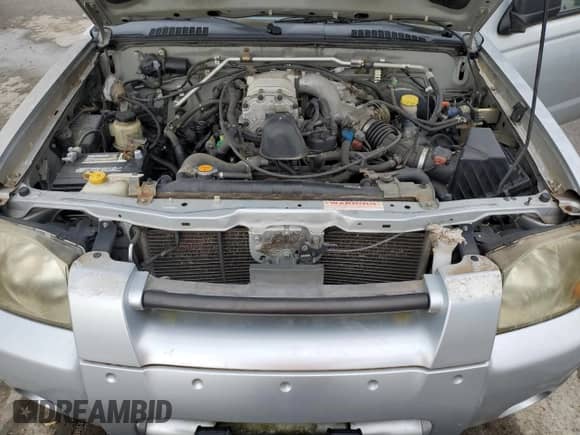 2002 Nissan Frontier SVE с VIN 1N6MD27YX2C370951, выставлен на аукционе Copart как лот 59499485 с пробегом 180 444 миль миль и Списание • Salvage title. История ставок и продаж доступна на DreamBid. Изображение 11.