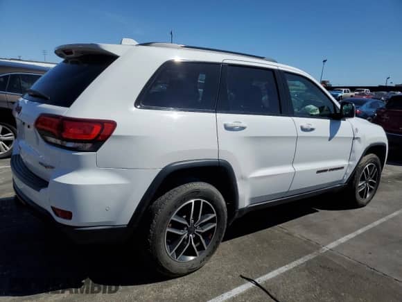 2021 Jeep Grand Cherokee Trailhawk z VIN 1C4RJFLG5MC565316, wystawiony jako Copart lot #60751955 z przebiegiem 69 261 mil mil oraz Szkoda całkowita • Salvage title. Historia ofert i sprzedaży dostępna na DreamBid. Obrazek 3.