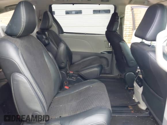 2012 Toyota Sienna SE with VIN 5TDXK3DC2CS235211, listed as a IAAI auction lot 42390354 with 242,602 mi miles and . Bid and sale history available at DreamBid. Image 8.