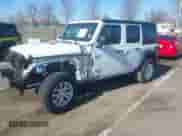 2023 Jeep Wrangler Sport S z VIN 1C4HJXDN4PW702277, wystawiony jako IAAI lot #41835864 z przebiegiem 27 768 mil mil oraz . Historia ofert i sprzedaży dostępna na DreamBid. Obrazek 2.