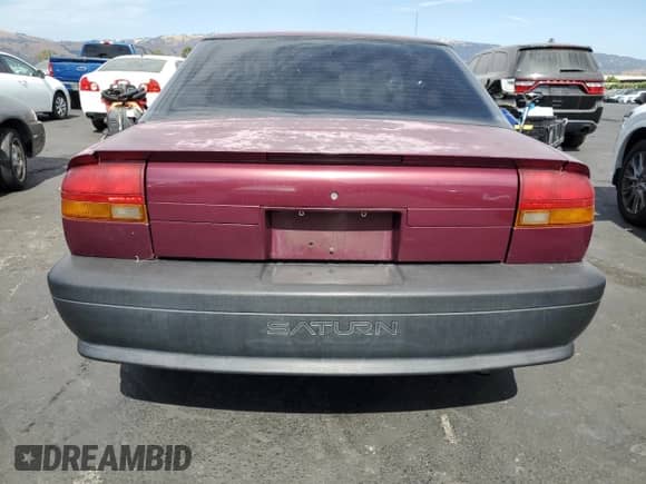 1995 Saturn SL with VIN 1G8ZH5286SZ149862, listed as a Copart auction lot 70059855 with 103,300 mi miles and Salvage title. Bid and sale history available at DreamBid. Image 6.