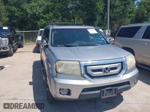 2010 Honda Pilot Touring with VIN 5FNYF3H94AB022723, listed as a IAAI auction lot 42378211 with 326,338 mi miles and . Bid and sale history available at DreamBid. Image 6.