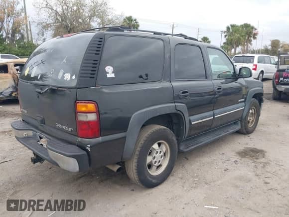 2003 Chevrolet Tahoe LT with VIN 1GNEC13Z93R296379, listed as a IAAI auction lot 41574575 with 301,567 mi miles and . Bid and sale history available at DreamBid. Image 4.
