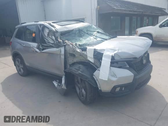 2019 Honda Passport Touring with VIN 5FNYF8H92KB011685, listed as a IAAI auction lot 43117835 with Not provided miles and . Bid and sale history available at DreamBid. Image 1.