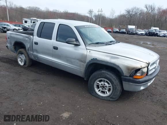 2003 Dodge Dakota Sport with VIN 1D7HG38X13S267227, listed as a IAAI auction lot 41952281 with 119,641 mi miles and . Bid and sale history available at DreamBid. Image 1.