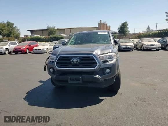 2018 Toyota Tacoma SR5 z VIN 3TMAZ5CN0JM059076, wystawiony jako Copart lot #71305965 z przebiegiem 80 502 mil mil oraz Szkoda całkowita • Salvage title. Historia ofert i sprzedaży dostępna na DreamBid. Obrazek 13.