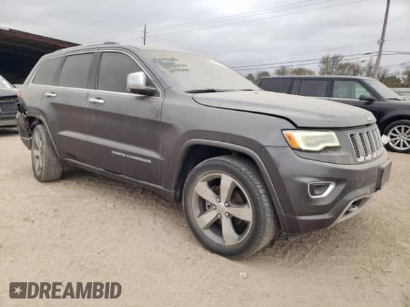 2016 Jeep Grand Cherokee High Altitude with VIN 1C4RJECG4GC314575, listed as a Copart auction lot 84265744 with 129,144 mi miles and Salvage title. Bid and sale history available at DreamBid. Image 4.
