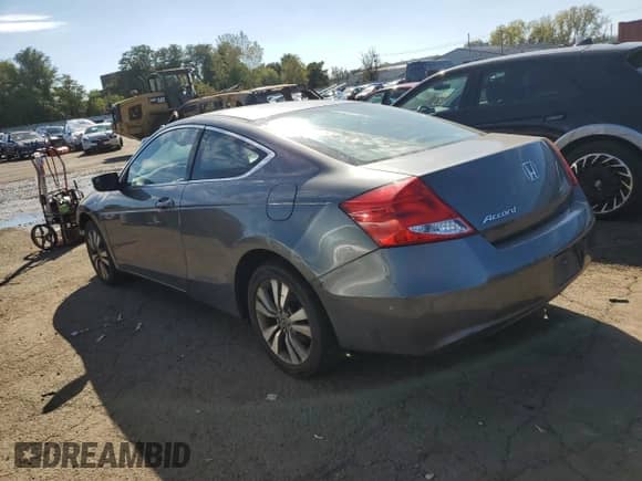 2012 Honda Accord LX-S with VIN 1HGCS1B33CA018111, listed as a Copart auction lot 82207625 with 218,517 mi miles and Clean title. Bid and sale history available at DreamBid. Image 2.