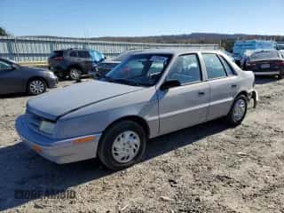 1994 Dodge Shadow with VIN 1B3AP28D5RN193704, listed as a Copart auction lot 82825004 with 90,223 mi miles and Salvage title. Bid and sale history available at DreamBid. Image 1.