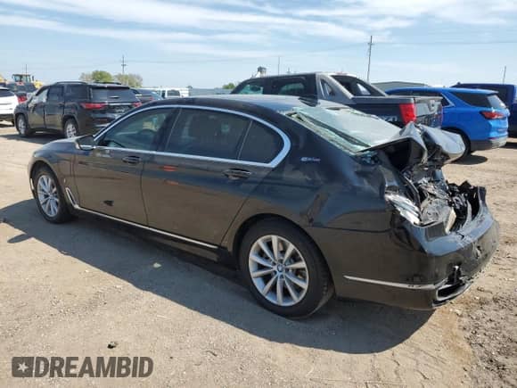 2017 BMW 7 Series 740e xDrive with VIN WBA7J2C31HG497945, listed as a Copart auction lot 80494365 with 54,846 mi miles and Salvage title. Bid and sale history available at DreamBid. Image 2.