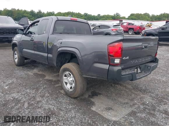 2023 Toyota Tacoma SR with VIN 3TYSX5EN6PT021792, listed as a IAAI auction lot 43037546 with 20,673 mi miles and . Bid and sale history available at DreamBid. Image 3.