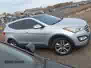 2015 Hyundai Santa Fe z VIN 5XYZW4LAXFG294009, wystawiony jako IAAI lot #43493851 z przebiegiem 89 481 mil mil oraz . Historia ofert i sprzedaży dostępna na DreamBid. Obrazek 13.