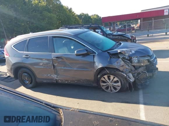 2014 Honda CR-V EX-L with VIN 2HKRM4H73EH704207, listed as a IAAI auction lot 43106801 with 132,005 mi miles and . Bid and sale history available at DreamBid. Image 13.