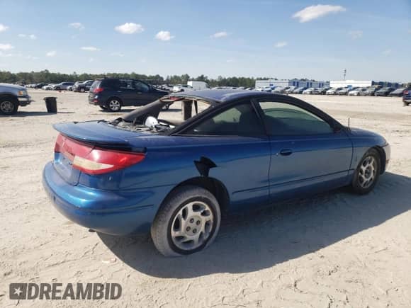2000 Saturn SC с VIN 1G8ZP1285YZ140090, выставлен на аукционе Copart как лот 61026775 с пробегом Не указан миль и На запчасти • Non repairable. История ставок и продаж доступна на DreamBid. Изображение 3.
