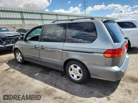 2001 Honda Odyssey EX с VIN 2HKRL18671H543086, выставлен на аукционе Copart как лот 69700575 с пробегом 163 931 миль миль и Списание • Salvage title. История ставок и продаж доступна на DreamBid. Изображение 2.