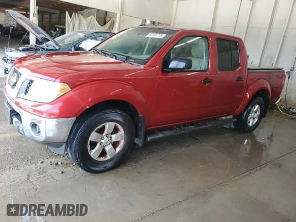 2010 Nissan Frontier SE with VIN 1N6AD0ER2AC432134, listed as a Copart auction lot 80090775 with 132,706 mi miles and Salvage title. Bid and sale history available at DreamBid. Image 1.