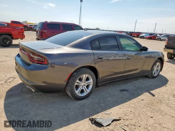 2020 Dodge Charger SXT с VIN 2C3CDXBG7LH214038, выставлен на аукционе Copart как лот 69014205 с пробегом 98 520 миль миль и Чистый • Clean title. История ставок и продаж доступна на DreamBid. Изображение 3.