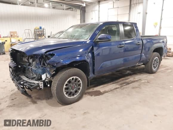 2024 Toyota Tacoma SR5 with VIN 3TMLB5JN3RM054207, listed as a IAAI auction lot 41171946 with 3,808 mi miles and . Bid and sale history available at DreamBid. Image 2.