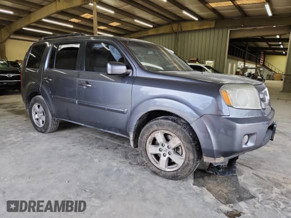 2011 Honda Pilot EX-L z VIN 5FNYF4H7XBB084519, wystawiony jako Copart lot #68644595 z przebiegiem 186 578 mil mil oraz Szkoda całkowita • Salvage title. Historia ofert i sprzedaży dostępna na DreamBid. Obrazek 4.