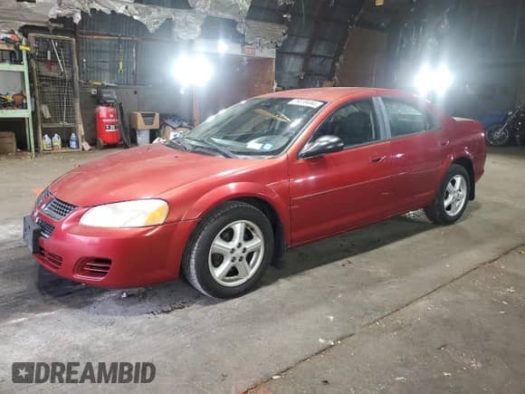 2004 Dodge Stratus SXT with VIN 1B3EL46R04N361278, listed as a Copart auction lot 79218494 with 73,075 mi miles and Salvage title. Bid and sale history available at DreamBid. Image 1.