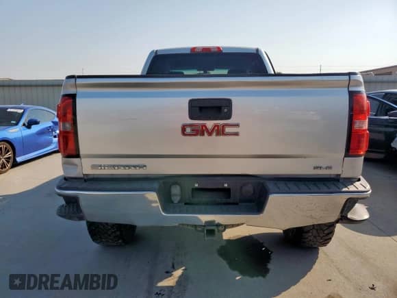 2014 GMC Sierra 1500 SLE z VIN 1GTV2UEC9EZ293975, wystawiony jako Copart lot #81319515 z przebiegiem 141 217 mil mil oraz Czysty tytuł • Clean title. Historia ofert i sprzedaży dostępna na DreamBid. Obrazek 6.