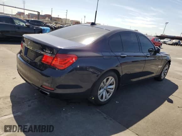 2011 BMW 7 Series 740i with VIN WBAKA4C55BC613170, listed as a Copart auction lot 68973425 with 127,434 mi miles and Salvage title. Bid and sale history available at DreamBid. Image 3.