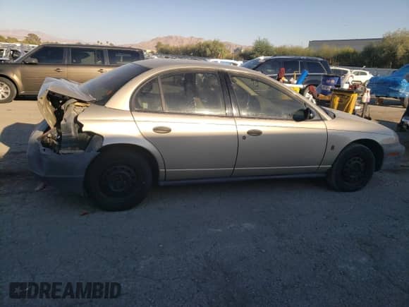 1997 Saturn SL with VIN 1G8ZH5282VZ258078, listed as a Copart auction lot 73436834 with 94,842 mi miles and Salvage title. Bid and sale history available at DreamBid. Image 3.