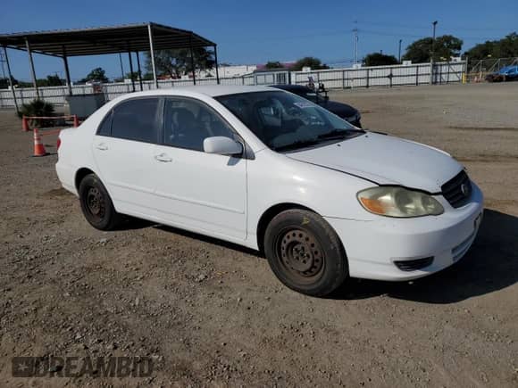 2003 Toyota Corolla LE with VIN JTDBR32E730050858, listed as a Copart auction lot 84818375 with 163,106 mi miles and Salvage title. Bid and sale history available at DreamBid. Image 4.
