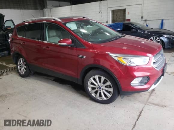 2017 Ford Escape Titanium with VIN 1FMCU9J92HUB62618, listed as a Copart auction lot 61932215 with 122,189 mi miles and Salvage title. Bid and sale history available at DreamBid. Image 4.