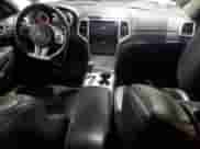 2012 Jeep Grand Cherokee SRT-8 z VIN 1C4RJFDJ7CC187475, wystawiony jako Copart lot #45191285 z przebiegiem 133 748 mil mil oraz Szkoda całkowita • Salvage title. Historia ofert i sprzedaży dostępna na DreamBid. Obrazek 8.