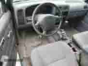 1997 Nissan Frontier XE z VIN 1N6SD16Y0VC329686, wystawiony jako Copart lot #73103584 z przebiegiem 105 657 mil mil oraz Szkoda całkowita • Salvage title. Historia ofert i sprzedaży dostępna na DreamBid. Obrazek 8.