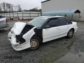 1994 Saturn SL with VIN 1G8ZJ5578RZ203874, listed as a Copart auction lot 80235024 with 232,040 mi miles and Salvage title. Bid and sale history available at DreamBid. Image 1.