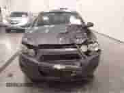 2012 Chevrolet Sonic LT z VIN 1G1JD5SH9C4168041, wystawiony jako IAAI lot #43448554 z przebiegiem 103 876 mil mil oraz . Historia ofert i sprzedaży dostępna na DreamBid. Obrazek 12.