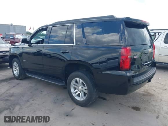 2020 Chevrolet Tahoe LT with VIN 1GNSCBKCXLR299233, listed as a IAAI auction lot 43131742 with 77,843 mi miles and . Bid and sale history available at DreamBid. Image 3.