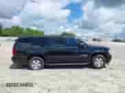 2010 Chevrolet Suburban LT z VIN 1GNUCJE08AR192831, wystawiony jako IAAI lot #42534754 z przebiegiem 165 741 mil mil oraz . Historia ofert i sprzedaży dostępna na DreamBid. Obrazek 13.