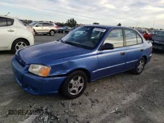 2000 Hyundai Accent z VIN KMHCG45GXYU125691, wystawiony jako Copart lot #87253294 z przebiegiem 91 062 mil mil oraz Szkoda całkowita • Salvage title. Historia ofert i sprzedaży dostępna na DreamBid. Obrazek 1.