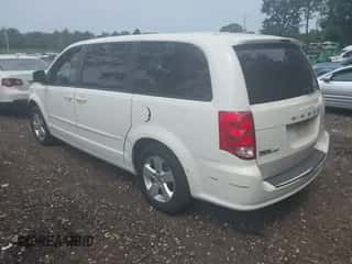 2013 Dodge Grand Caravan SE with VIN 2C4RDGBG1DR517088, listed as a IAAI auction lot 42913307 with 170,913 mi miles and . Bid and sale history available at DreamBid. Image 3.