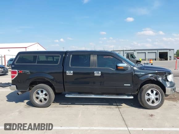 2013 Ford F-150 Lariat with VIN 1FTFW1ET3DKE67750, listed as a IAAI auction lot 43240995 with 159,269 mi miles and . Bid and sale history available at DreamBid. Image 13.