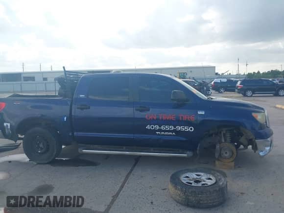 2007 Toyota Tundra SR5 z VIN 5TBET54107S454598, wystawiony jako IAAI lot #42558681 z przebiegiem 309 838 mil mil oraz . Historia ofert i sprzedaży dostępna na DreamBid. Obrazek 14.
