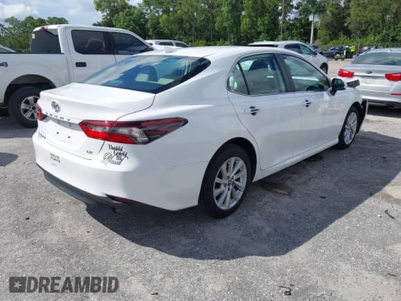 2021 Toyota Camry LE with VIN 4T1C11AK8MU601313, listed as a IAAI auction lot 43383218 with 34,384 mi miles and . Bid and sale history available at DreamBid. Image 4.
