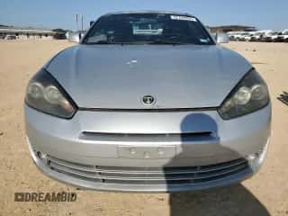 2008 Hyundai Tiburon GT с VIN KMHHN66F28U293287, выставлен на аукционе Copart как лот 52166005 с пробегом 106 072 миль миль и Чистый • Clean title. История ставок и продаж доступна на DreamBid. Изображение 5.