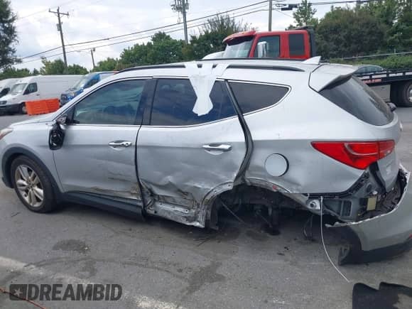 2014 Hyundai Santa Fe with VIN 5XYZU3LA2EG173067, listed as a IAAI auction lot 43309222 with 136,499 mi miles and . Bid and sale history available at DreamBid. Image 14.