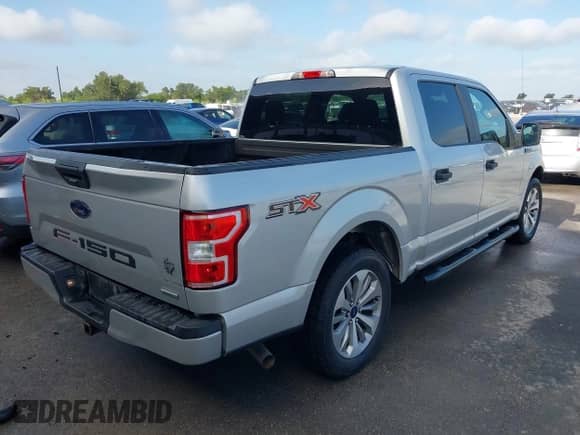 2018 Ford F-150 XL with VIN 1FTEW1CP8JKC70201, listed as a IAAI auction lot 42620912 with 124,499 mi miles and . Bid and sale history available at DreamBid. Image 4.