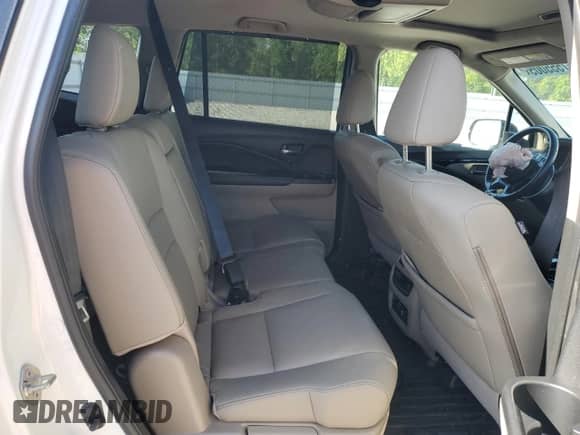 2019 Honda Pilot Touring 8-Passenger z VIN 5FNYF6H91KB085992, wystawiony jako Copart lot #57555005 z przebiegiem 59 063 mil mil oraz Szkoda całkowita • Salvage title. Historia ofert i sprzedaży dostępna na DreamBid. Obrazek 11.