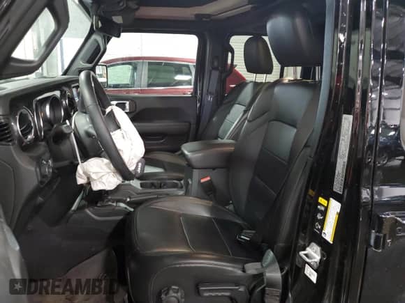 2023 Jeep Wrangler Sahara Altitude with VIN 1C4HJXEG9PW595565, listed as a Copart auction lot 77230394 with 28,477 mi miles and Salvage title. Bid and sale history available at DreamBid. Image 7.