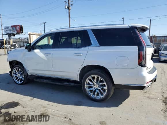 2022 Cadillac Escalade Premium Luxury с VIN 1GYS4BKL6NR153415, выставлен на аукционе Copart как лот 52036525 с пробегом 70 148 миль миль и Списание • Salvage title. История ставок и продаж доступна на DreamBid. Изображение 2.