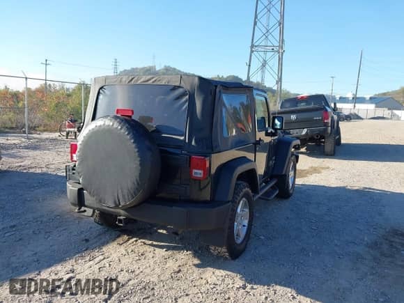 2012 Jeep Wrangler Sport with VIN 1C4AJWAG1CL168717, listed as a IAAI auction lot 43461521 with 106,272 mi miles and . Bid and sale history available at DreamBid. Image 4.