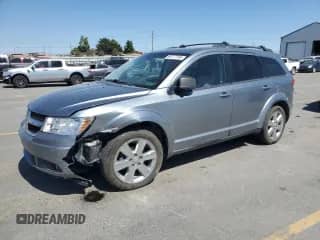 2009 Dodge Journey SXT with VIN 3D4GH57V99T171841, listed as a Copart auction lot 68777785 with 169,668 mi miles and Salvage title. Bid and sale history available at DreamBid. Image 1.