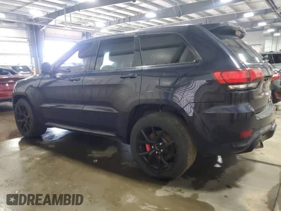 2021 Jeep Grand Cherokee SRT with VIN 1C4RJFDJXMC561210, listed as a Copart auction lot 68512365 with Not provided miles and Salvage title. Bid and sale history available at DreamBid. Image 2.