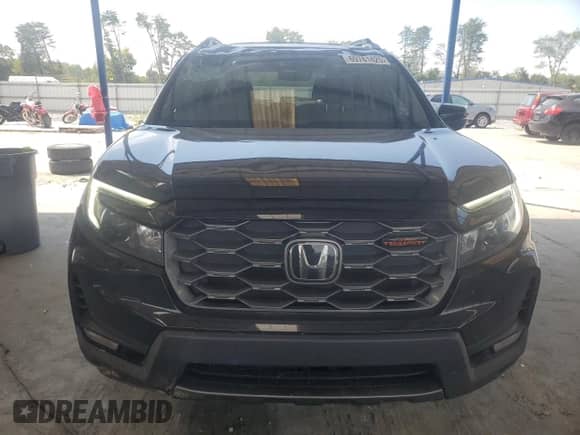 2023 Honda Passport TrailSport z VIN 5FNYF8H69PB003130, wystawiony jako Copart lot #69781425 z przebiegiem 78 089 mil mil oraz Szkoda całkowita • Salvage title. Historia ofert i sprzedaży dostępna na DreamBid. Obrazek 5.